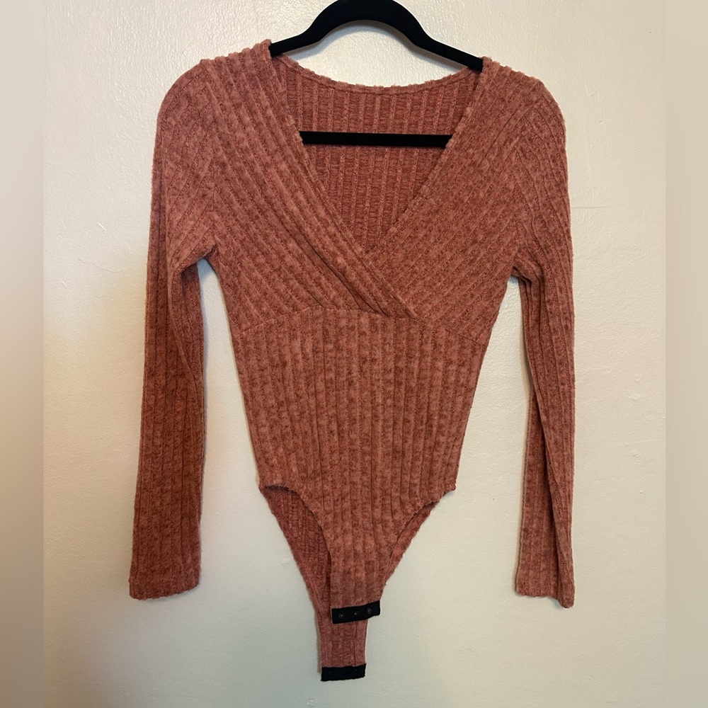 Very soft pinkish/orange v-neck bodysuit - size small